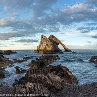 Buy canvas prints of Bow Fiddle Rock golden hour by Anthony McGeever