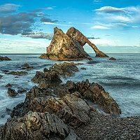 Buy canvas prints of Bow Fiddle Rock and blue sky  by Anthony McGeever