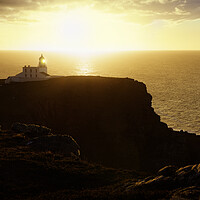 Buy canvas prints of A hazy sunset over Stoer Lighthouse by Anthony McGeever
