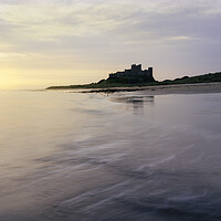 Buy canvas prints of Bamburgh Castle Sunrise  by Anthony McGeever