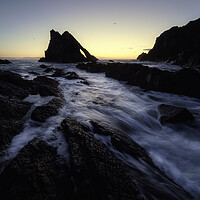 Buy canvas prints of Ethereal Sunrise at Bow Fiddle Rock by Anthony McGeever