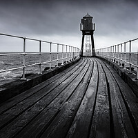 Buy canvas prints of Whitby's East Pier in black and white  by Anthony McGeever