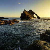 Buy canvas prints of Orange Glow on Bow Fiddle Rock   by Anthony McGeever