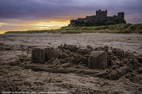 Bamburgh Castle in Sand Picture Board by Jonathan Bird