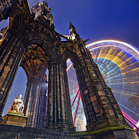 Buy canvas prints of The Scott Monument in Edinburgh with Ferris wheel. by Andrea Obzerova