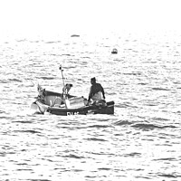 Buy canvas prints of Silver light, St Ives fisherman in the sunlight. by Ed Whiting