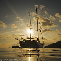 Buy canvas prints of Yacht in sunset taken from the water in Philippines. by Ed Whiting