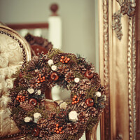 Buy canvas prints of Berries And Cones Christmas Wreath by Amanda Elwell
