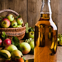 Buy canvas prints of Bottled Cider With Apples by Amanda Elwell