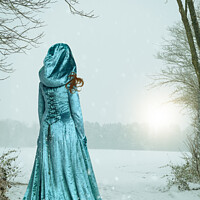 Buy canvas prints of Robed Woman In Snow by Amanda Elwell