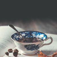 Buy canvas prints of Teacup On Book by Amanda Elwell