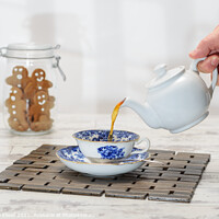 Buy canvas prints of Pouring A Cup Of Tea by Amanda Elwell