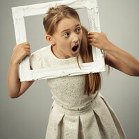 Buy canvas prints of Girl In Photo Frame by Amanda Elwell