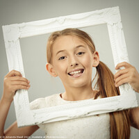 Buy canvas prints of Young Girl In Frame by Amanda Elwell