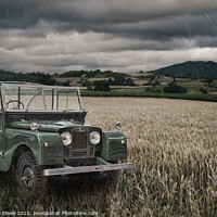 Buy canvas prints of Vintage Land Rover in Field by Amanda Elwell