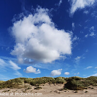 Buy canvas prints of Blue sky over Harlech beach in North wales by Peter Brownlow