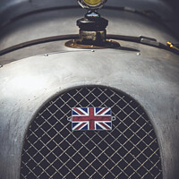 Buy canvas prints of CLASSIC RACE CAR WITH UNION JACK FLAG by Peter Greenway