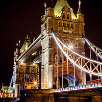 Buy canvas prints of The Iconic Tower Bridge In London At Night by Peter Greenway