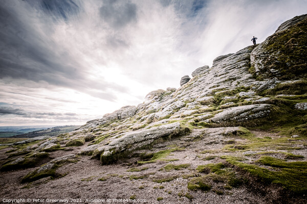 Man Stood Atop Of A Sloping Side Of Haytor Tor, Dartmoor Picture Board by Peter Greenway