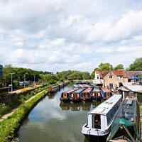 Buy canvas prints of Moored Canal Boats At Heyford Warf At Lower Heyford On The Oxford Canal by Peter Greenway