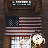 Buy canvas prints of Grand Central Station in New York City - Iconic Clock and USA Flag by Peter Greenway