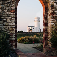 Buy canvas prints of The Lighthouse In Old Hunstanton At Sunset Through The Archway Of by Peter Greenway