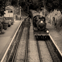 Buy canvas prints of Steam Train & Carriages Arriving At A Quaint English Railway Station by Peter Greenway