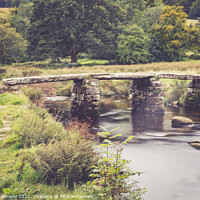 Buy canvas prints of The Ancient 'Clapper Bridge' At Packbridge, Dartmoor, Devon by Peter Greenway