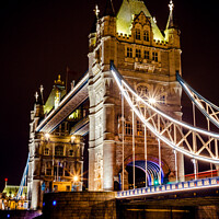 Buy canvas prints of Tower Bridge In London Illuminated At Night by Peter Greenway