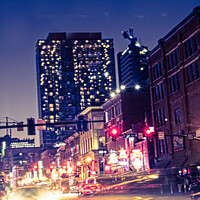 Buy canvas prints of Downtown Nashville, Tennessee On A Saturday Night by Peter Greenway