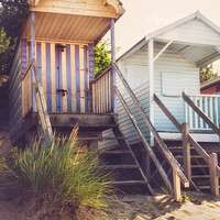 Buy canvas prints of Stilted Beach Huts On The Beach At Wells-next-the-Sea by Peter Greenway