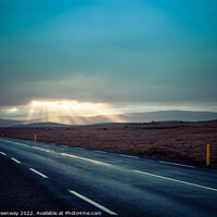 Buy canvas prints of Camper Van On An Icelandic Road With Light Shafts by Peter Greenway