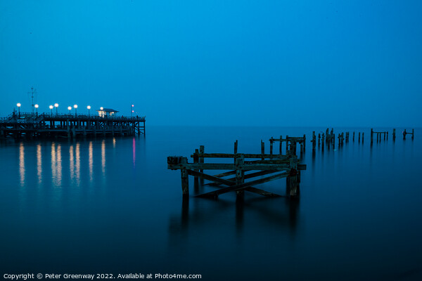 The Remains Of The Old Pier At Swanage, Dorset At Night Picture Board by Peter Greenway