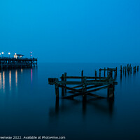 Buy canvas prints of The Remains Of The Old Pier At Swanage, Dorset At Night by Peter Greenway
