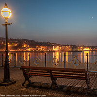 Buy canvas prints of Illuminated Lamp Post And Benches On Swanage Pier by Peter Greenway