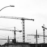 Buy canvas prints of Cranes On A Building Site In Berlin by Peter Greenway