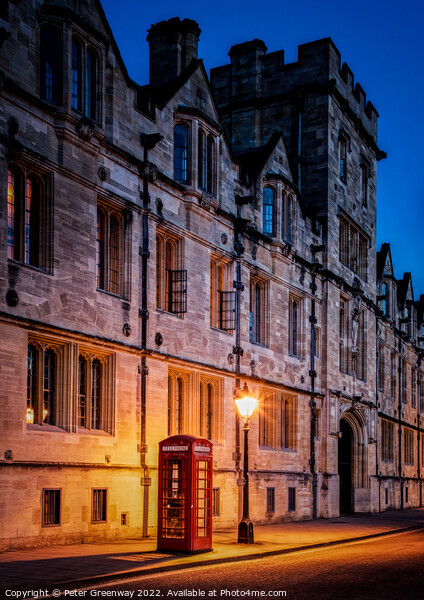 Illuminated Iconic Red British Telephone Box In Oxford City Centre Picture Board by Peter Greenway