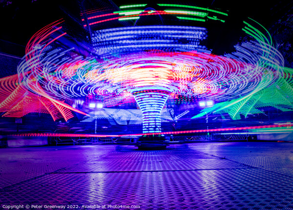 Light Trails From The Twisters Fairground Ride At The Woodstock  Picture Board by Peter Greenway