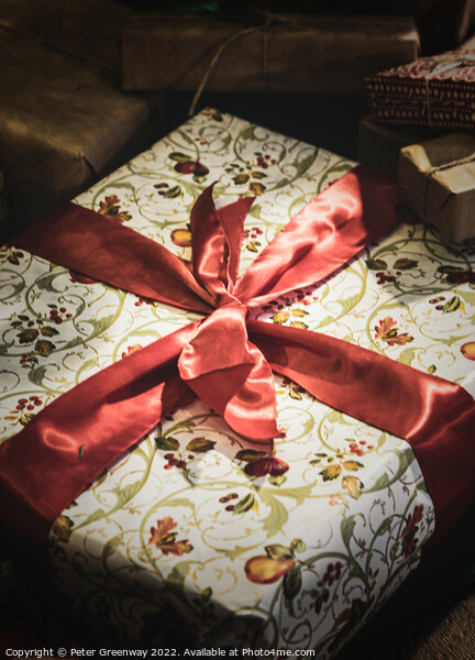 Wrapped Christmas Present Tied Up In Red Ribbon Picture Board by Peter Greenway