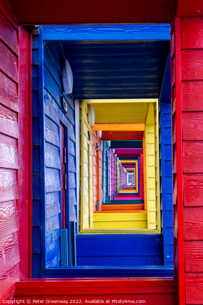 View Through The Porches Of Colourful Wooden Beach Huts At Saltb Picture Board by Peter Greenway