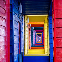 Buy canvas prints of View Through The Porches Of Colourful Wooden Beach Huts At Saltb by Peter Greenway