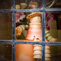 Buy canvas prints of Flowerpot Man In A Window Of A Cottage At Arlington Row, Bibury by Peter Greenway