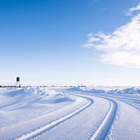 Buy canvas prints of Vehicle Tyre Tracks In The Snow Around Utsjoki, Finland by Peter Greenway