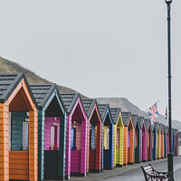 Buy canvas prints of Colourful Wooden Beach Huts At Saltburn-by-the-Sea by Peter Greenway