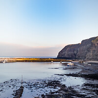 Buy canvas prints of Boats Mooted In The Harbour At Staithes Fishing Po by Peter Greenway