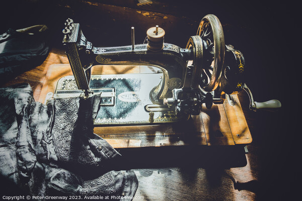 Hand Cranked Vintage Sewing Machine Sunlit On A Wo Picture Board by Peter Greenway