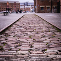 Buy canvas prints of Original Section Of Cobbled Street At The Historic Docks At Glou by Peter Greenway