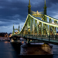 Buy canvas prints of The Liberty Bridge In Budapest At Dusk by Peter Greenway