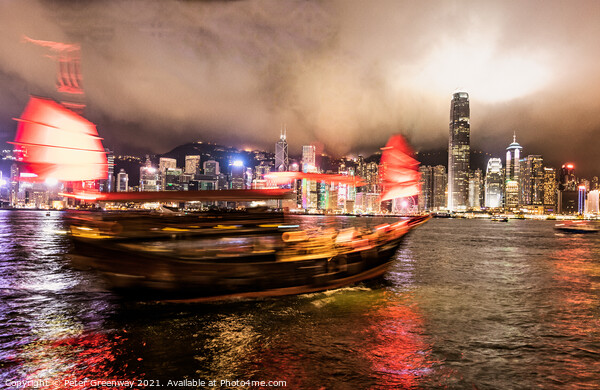 Chinese 'Junk' Boat Sailing On The Water In Victoria Harbour At  Picture Board by Peter Greenway