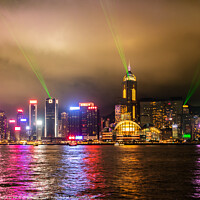 Buy canvas prints of Laser Light Show Over Victoria Harbour At Tsim Sha Tsui, Hong Ko by Peter Greenway